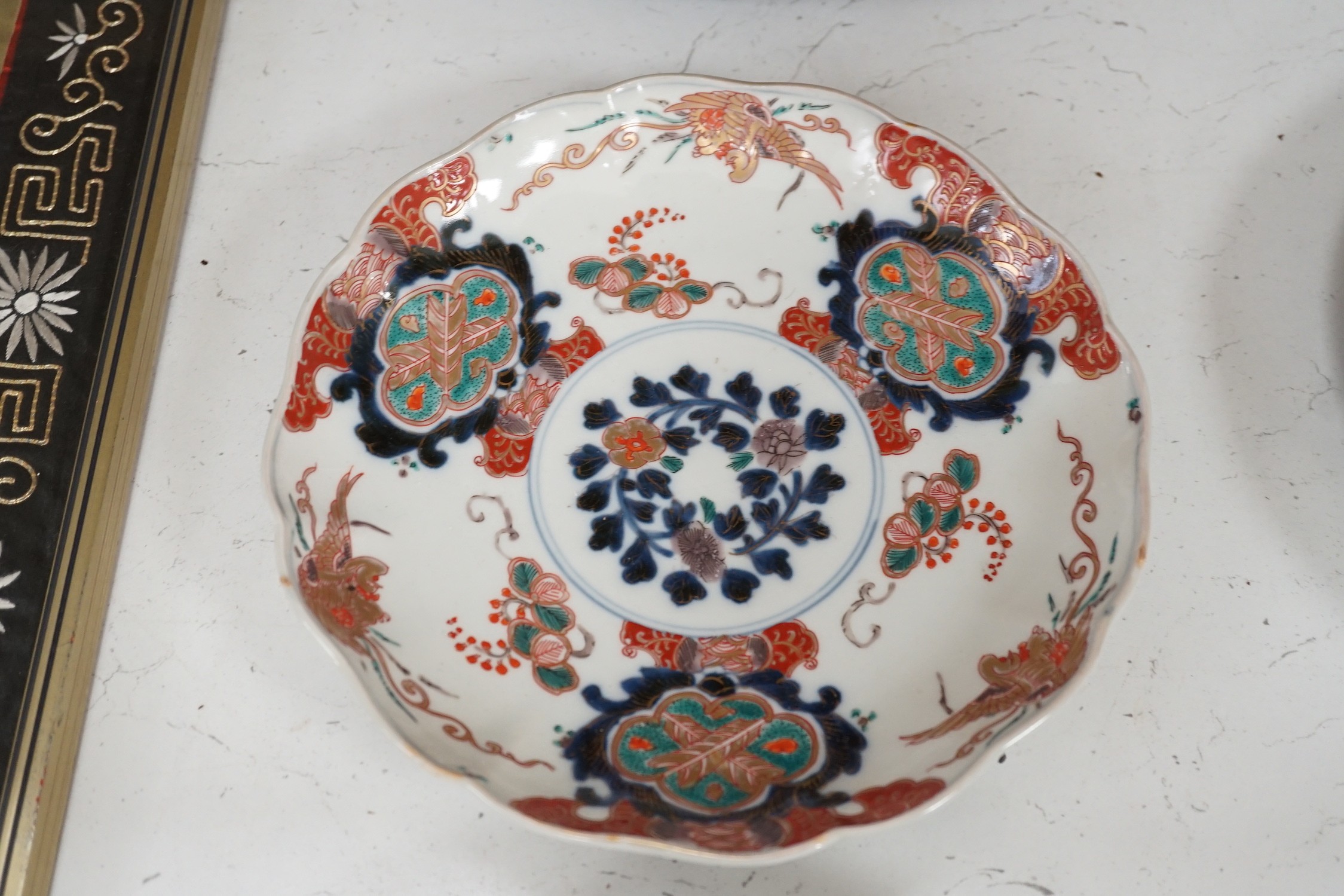 A group of 19th/20th century Japanese porcelain and pottery dishes. Largest 33cm diameter